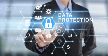 Businessman hand pressing button Data Protection
