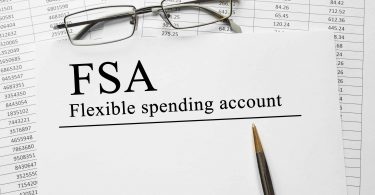 Paper with Flexible Spending Account FSA on a table