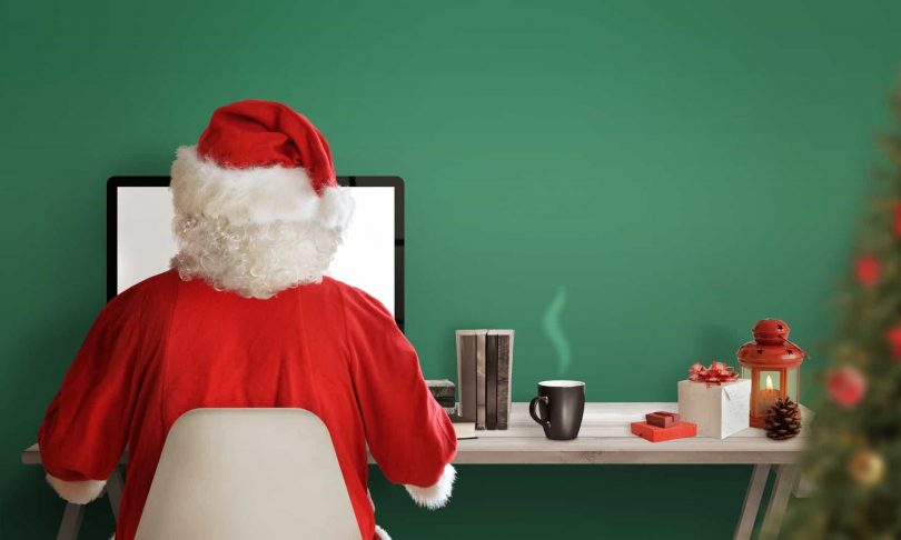 santa shops online using debt.com money tips