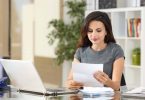Female small business owner plans to open her own business checking account