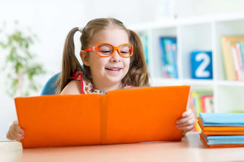 kid reading book