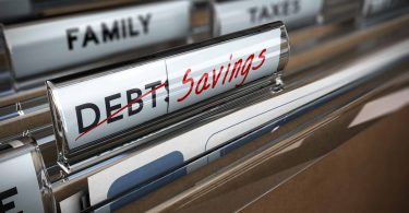 a file folder for debt becomes a folder for saving money after paying it all off