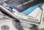 Credit card on dollars. Image concept of "is a balance transfer a good idea."