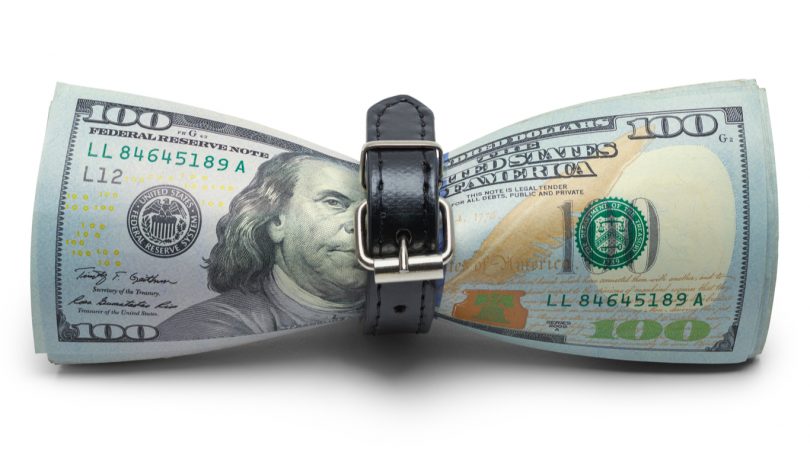 Cash Money being Tightened with Belt Isolated on White Background