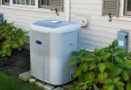 Heating and air conditioning inverter on the side of a house