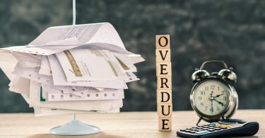 Overdue concept with stack of unpaid bills