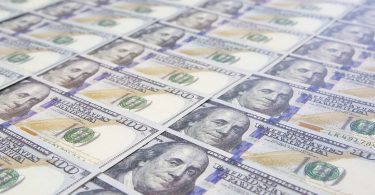 A lot of Money background. Dollars currency notes.