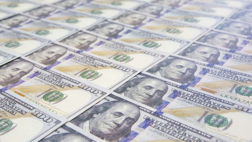 A lot of Money background. Dollars currency notes.