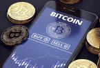 Smartphone with Bitcoin chart on-screen