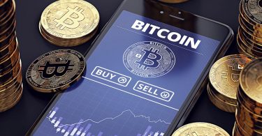 Smartphone with Bitcoin chart on-screen