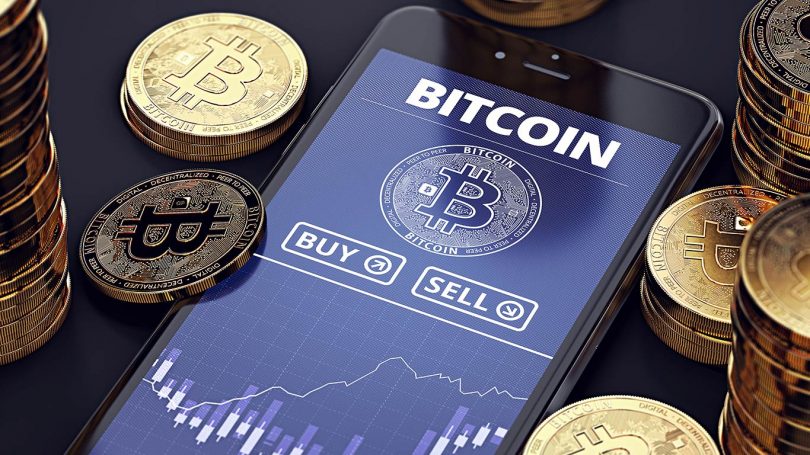 Smartphone with Bitcoin chart on-screen