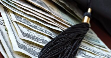 Higher education conceptual image with graduation