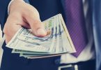 Businessman giving money, united states dollar