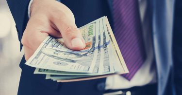 Businessman giving money, united states dollar