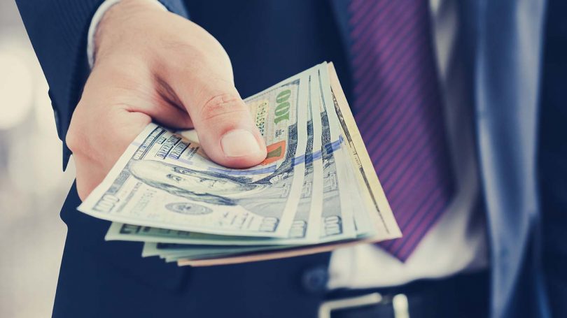 Businessman giving money, united states dollar