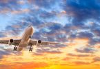 Commercial,Airplane,Flying,In,Beautiful,Sky,At,Sunset,travel,Concept.